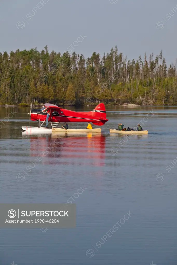 Canoeists getting picked by a float plane, Wabakimi Provincial Park