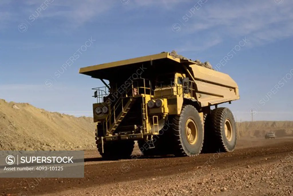 dump truck earth mover yellow SuperStock