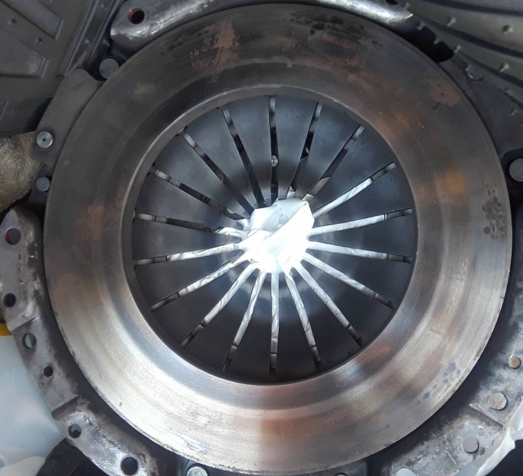 Can hot spots on pressure plate be fixed by sanding surface