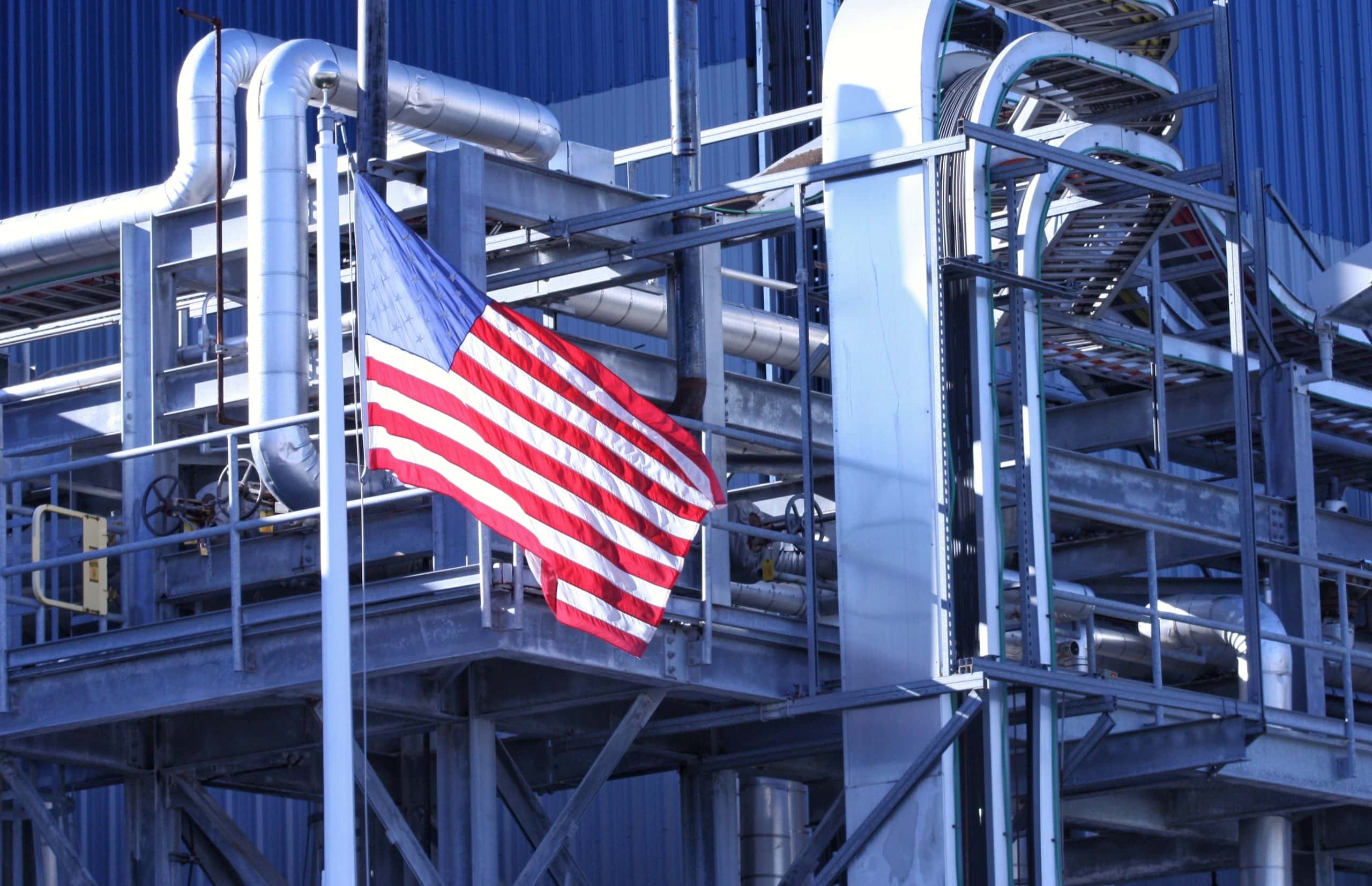 American Flag flying in front of manufacturing factory Swift Glass