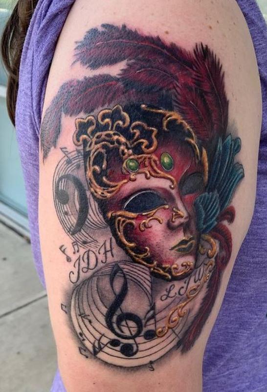 mask tattoo by Scotty Parker TattooNOW