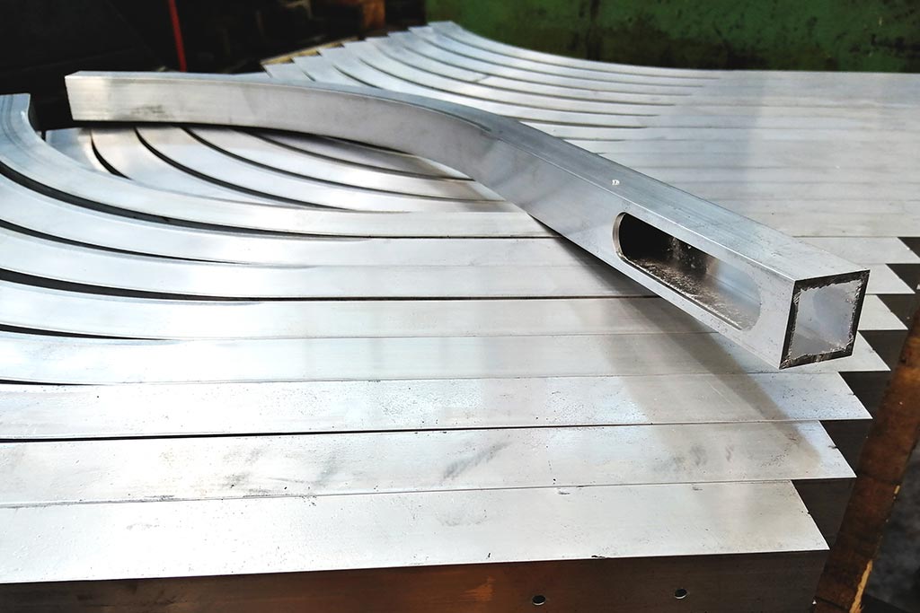 Bending and rolling aluminium tubing forming aluminium sections