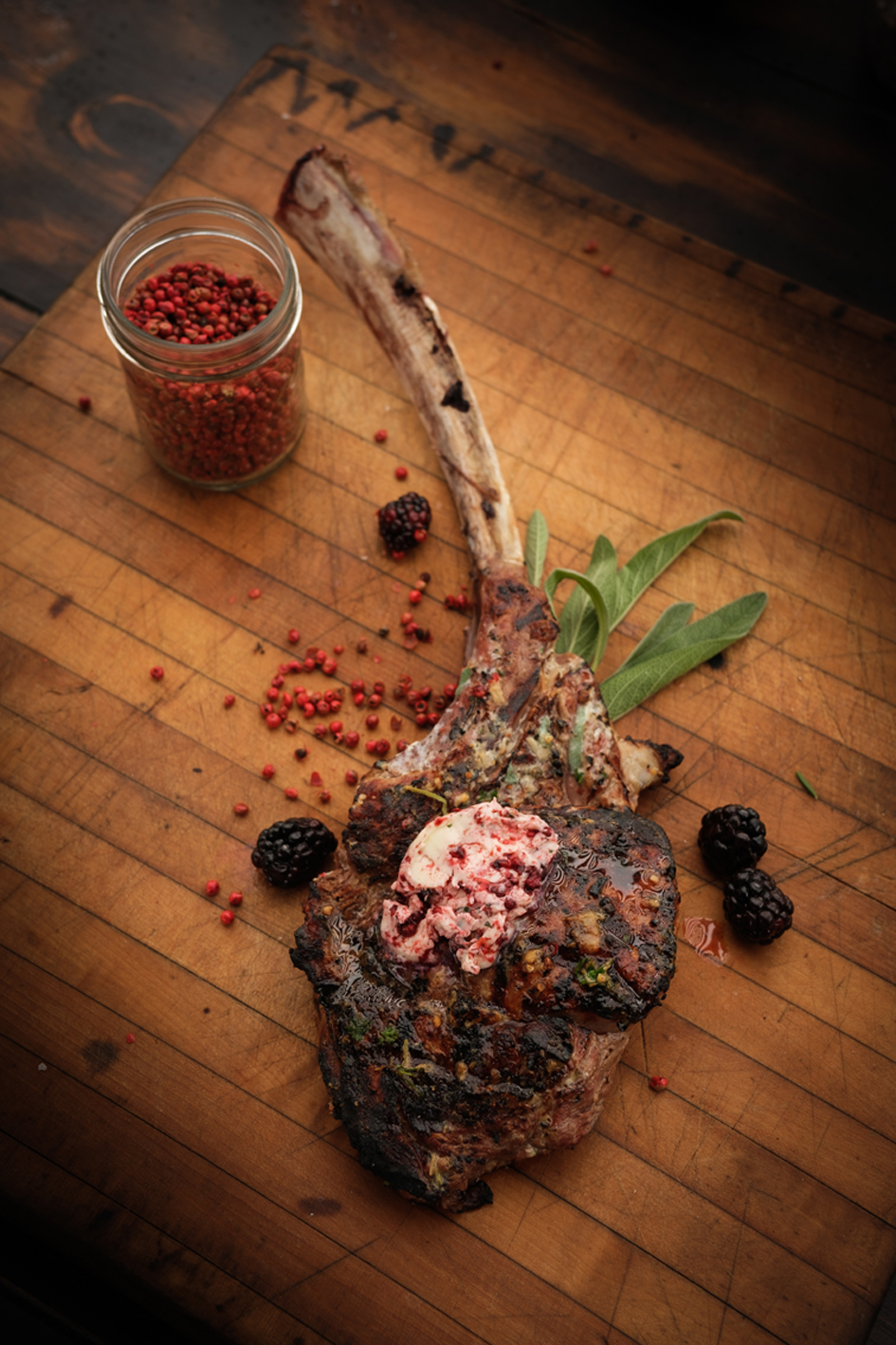 Grilled Veal Tomahawk Chop with Blackberry Pink Peppercorn Butter Ted