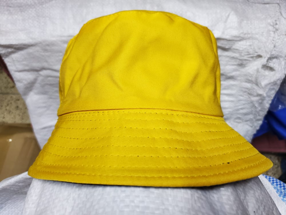 YELLOW BUCKET HAT Tekiria General Suppliers LTD