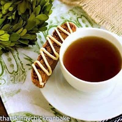Gingerbread Biscotti - Perfect holiday treats! Gingerbread Biscotti on a teacup saucer