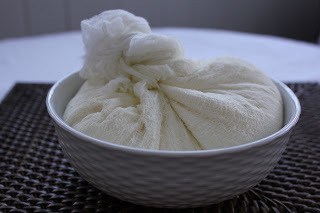 Luscious Ricotta Cheesecake made with homemade ricotta Ricotta wrapped in cheesecloth