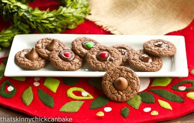 Double Chocolate Thumbprints - rich, tasty cookies for the chocoholic. Perfect for the holidays! Double Chocolate Thumbprints on a white rectangular tray.