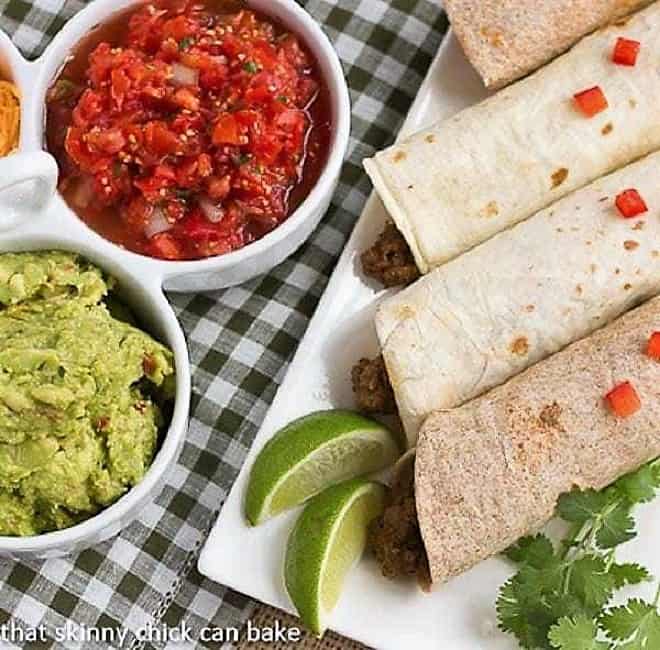 Soft Shell Tacos {Homemade Beef Tacos} - A super easy dinner recipe and you can tailor the spice to your liking! Overhead view of Soft Shell Tacos {Homemade Beef Tacos} on a platter next to toppings.