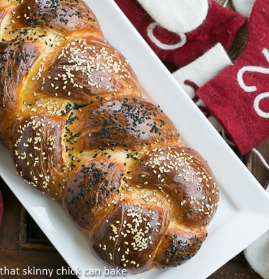 Perfect Braided Challah from Baking with Julia - a dense, chewy irresistible loaf, this challah recipe is a winner! Perfect Braided Challah from Baking with Julia on a white ceramic tray.