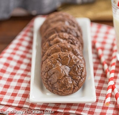 Double Chocolate Cookies on a white tray on a checkered napkin. Double Chocolate Cookies on a white tray.