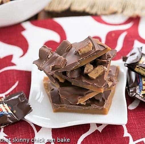 Double Dose English Toffee - Perfect English toffee recipe topped with MORE Toffee! Double Dose English Toffee pieces on a small white plate