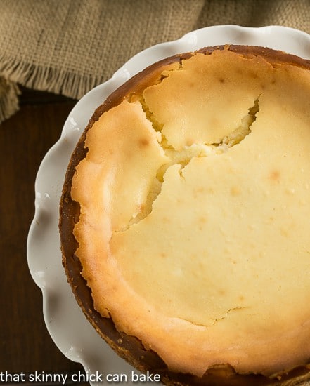 Lemon Bar Cheesecake - A luscious citrus cheesecake loaded with lemon curd Lemon Bar Cheesecake with cracks after baking.