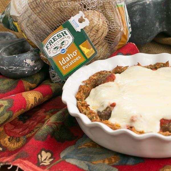Italian Poutine Pie | A savory pie with a hash brown crust, marinara, meatballs and gooey mozzarella.