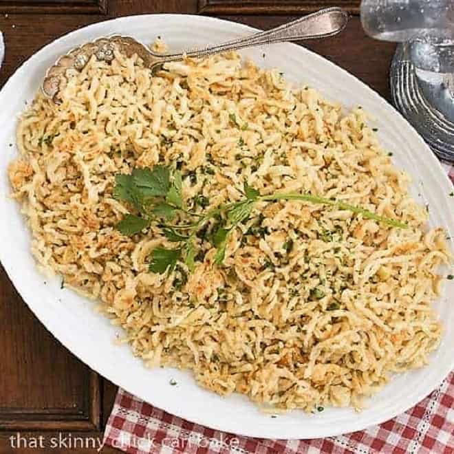 Spaetzel are German egg noodles that are the perfect alternative to potatoes or rice! Learn how to make spaetzel. Spaetzel (German egg noodles) on a large serving platter.