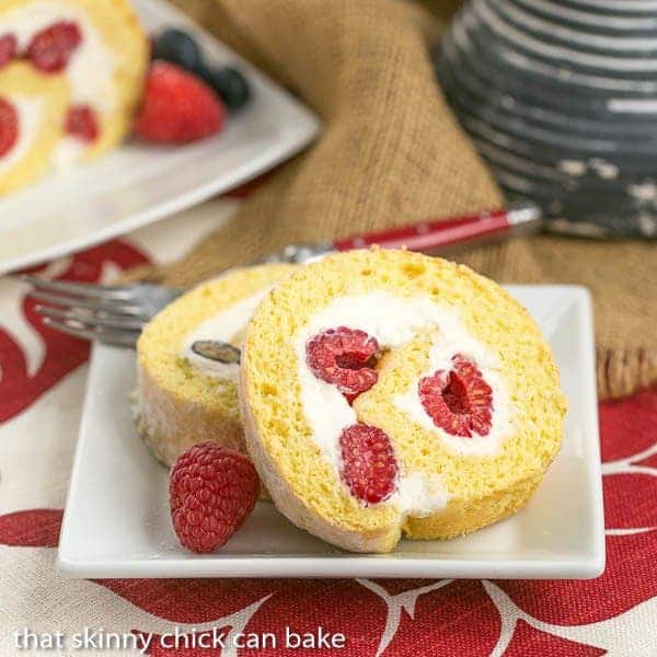 Berry Mascarpone Roulade - a sponge cake rolled around berries and a scrumptious mascarpone cream filling! Berry Roulade | A jellyroll made with a sponge cake rolled around mascarpone cream and fresh berries.