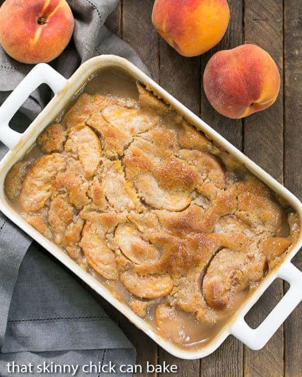 Fresh Peach Pudding - A self saucing peach dessert for a change from crisps and cobblers! Fresh Peach Pudding in a white rectangular casserole dish