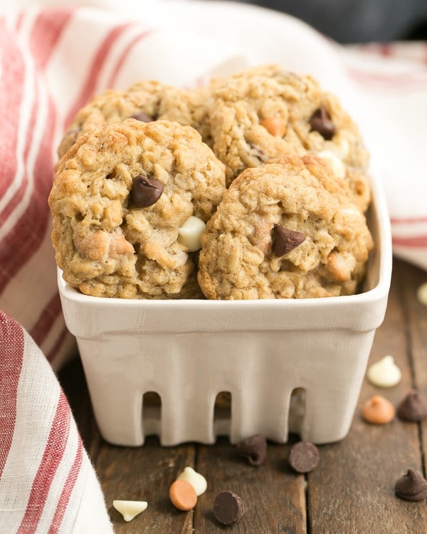 Triple Threat Oatmeal Cookies - Chewy, buttery and full of 3 varieties of baking chips Triple Threat Oatmeal Cookies in a ceramic container