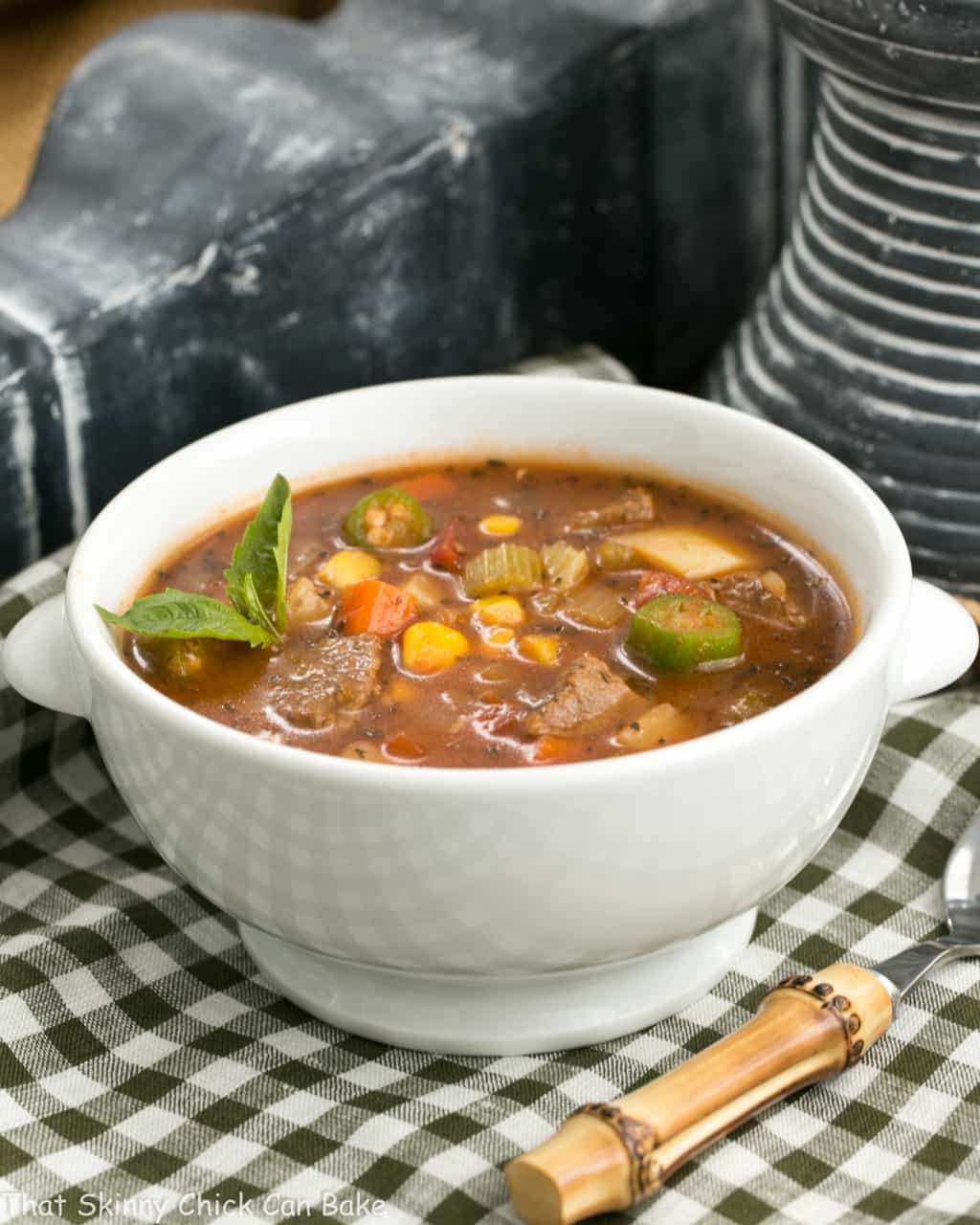 Vegetable Beef Soup - A healthy soup recipe chock full of vegetables and lean beef Vegetable Beef Soup in a white bowl on a checkered napkin.