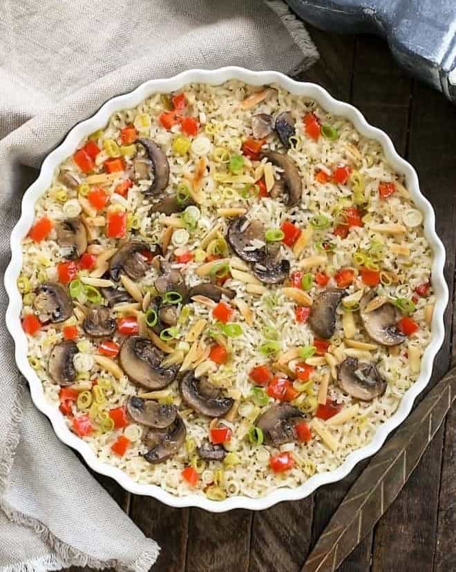 Overhead view of baked rice pilaf in a round dish.