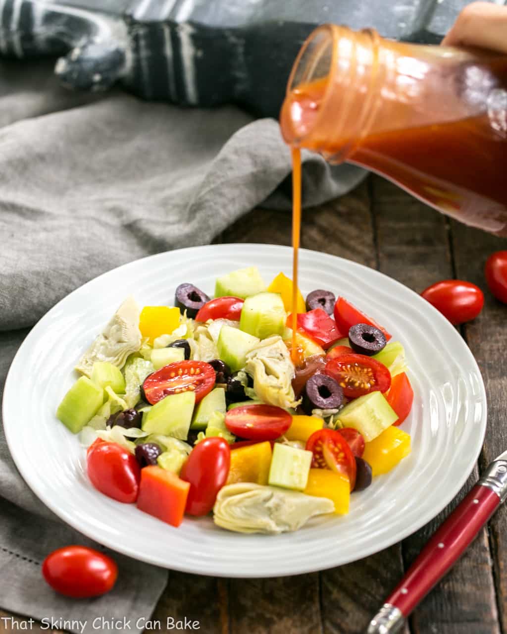 Easy Honey French Dressing - Lighter and tastier than what you can buy! Plus, it's a breeze to whip up! French Salad Dressing poured over a green salad.