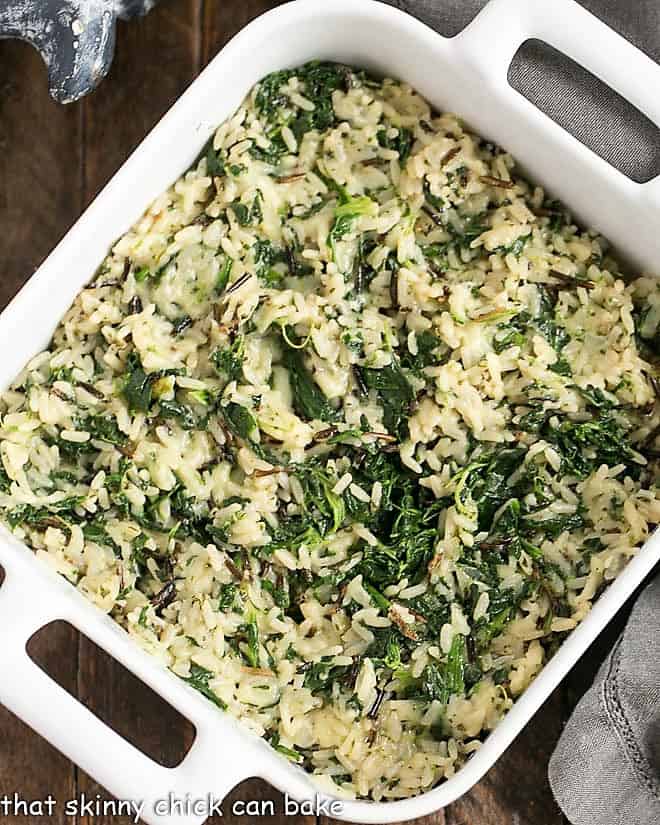 Cheesy Spinach Rice Casserole - an easy, flavorful side dish with spinach, long grain and wild rice and loads of Monterey jack cheese! Unbaked Cheesy Spinach Rice Casserole in a ceramic dish.