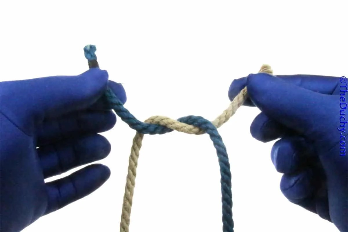 2. Make an overhand knot right on top of left. TheDuchy