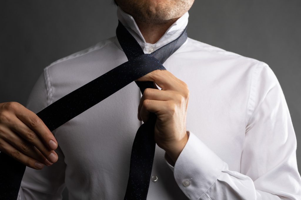 How to Tie a Four In Hand Knot (Step-By-Step Guide) - The Modest Man