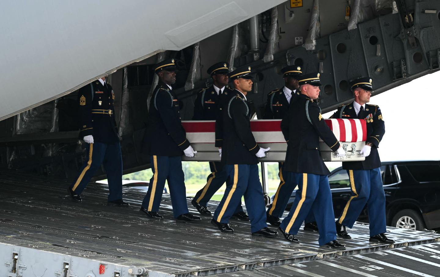 A US Army team carries the the remains of Sgt. Michael Emmanuel Swinton, 30, of Fayetteville, North Carolina, in Dover, Delaware, on July 22. Swinton was killed on July 19 at Erbil Air Base in Iraq.