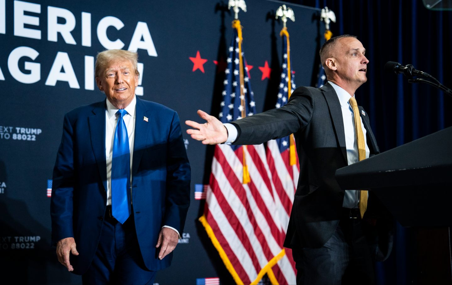 Former President Donald Trump speaks with Corey Lewandowski at a campaign rally on Monday, Oct. 23, 2023, in Derry, NH.