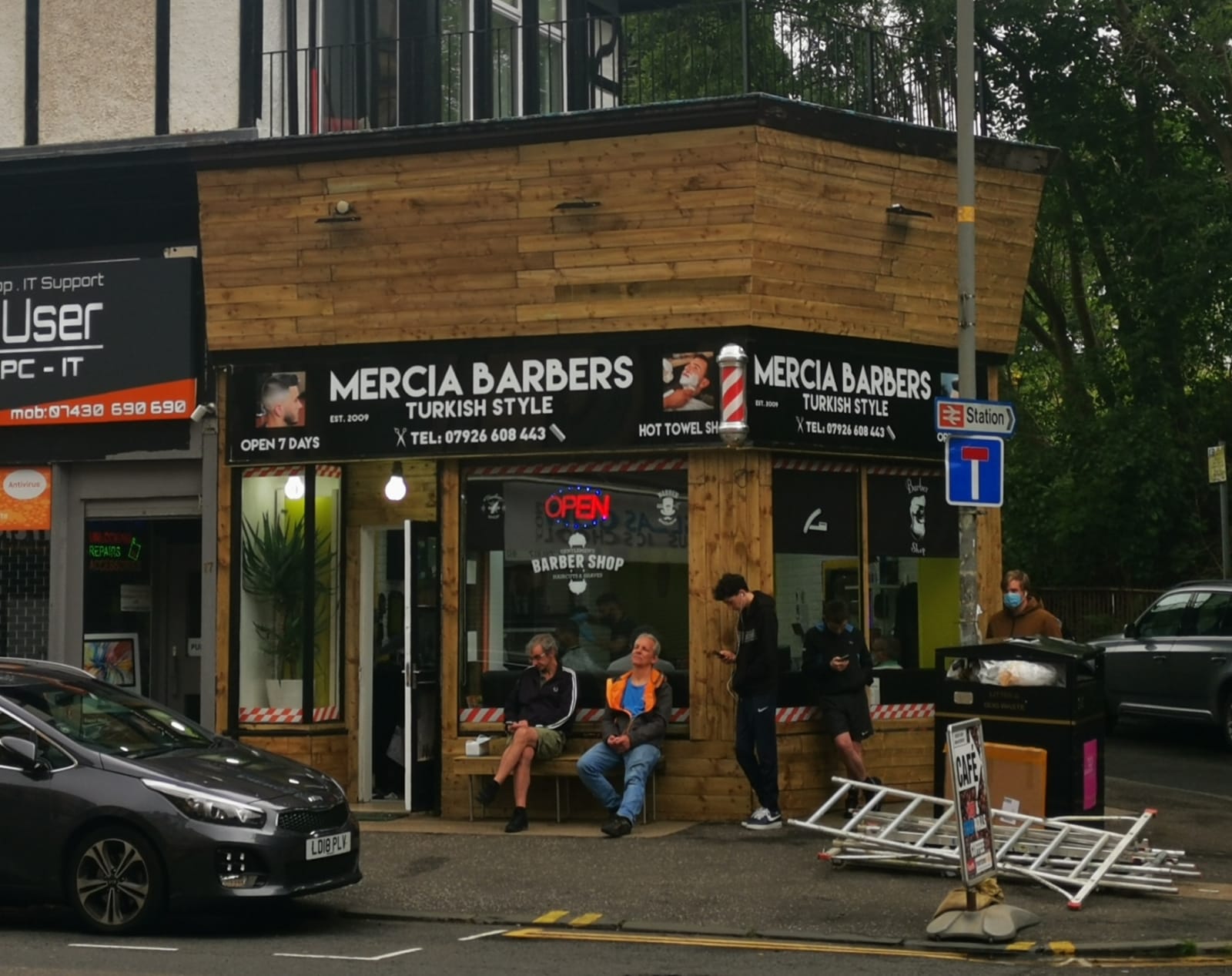 Coronavirus Scotland Punters queue outside Glasgow barbers as they