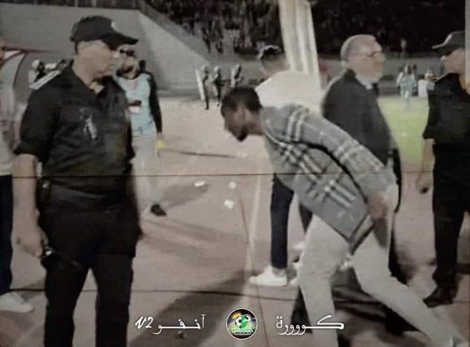 Rulani dodges and takes cover after angry Wydad fans throw missiles