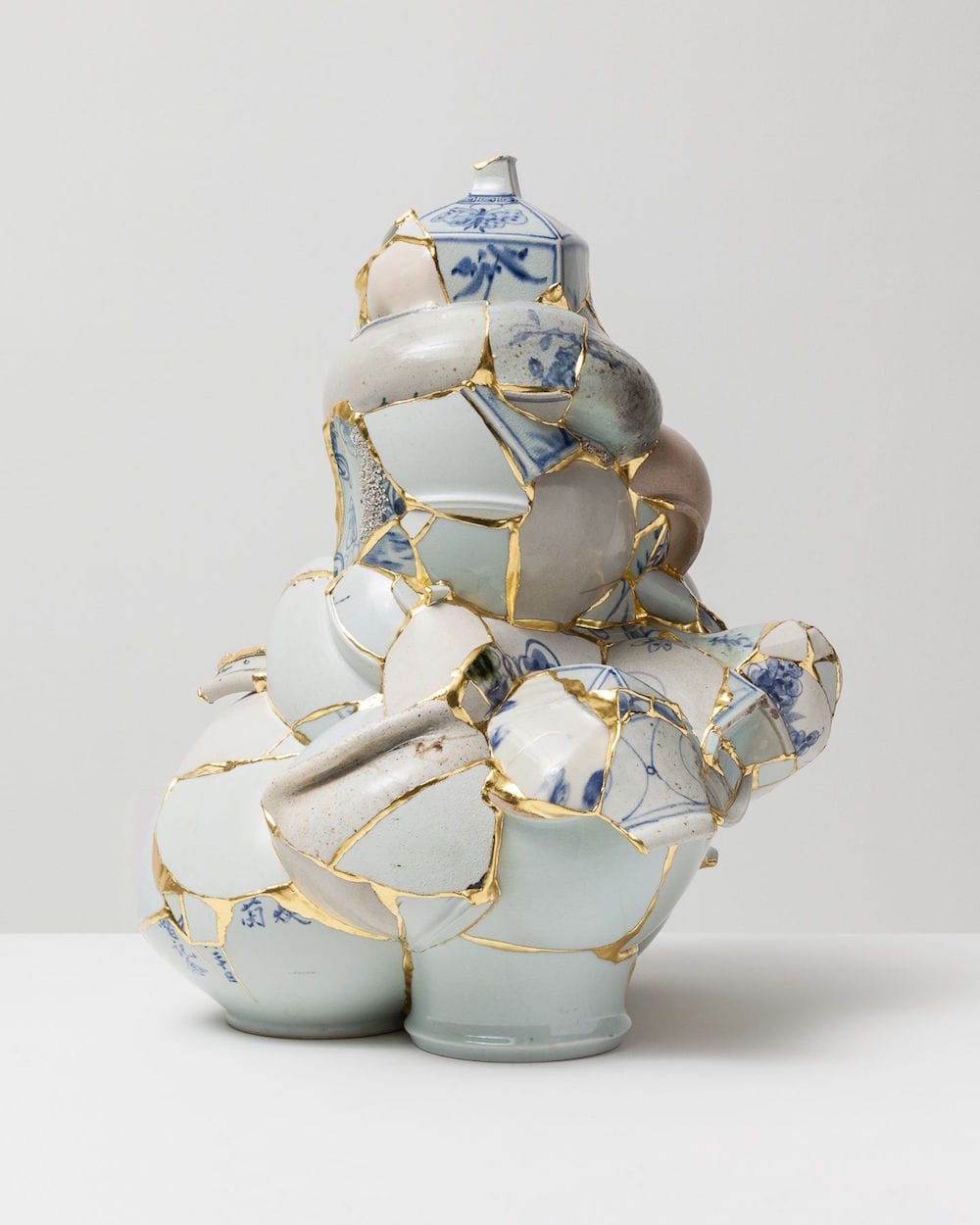 Shattered Porcelain Fragments Fused With Gold by Artist Yeesookyung