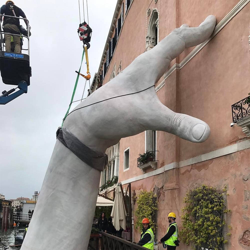 Support Monumental Hands Rise from the Water in Venice to Highlight