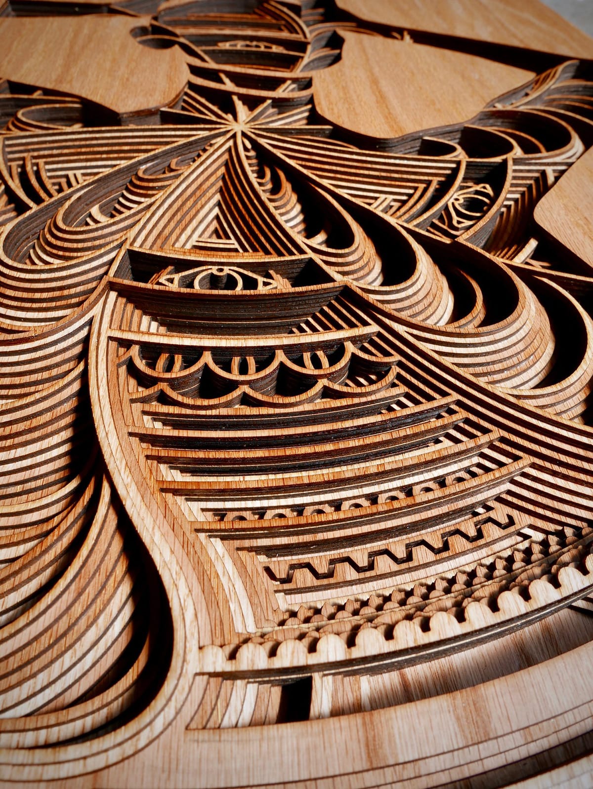 Cut Plywood Relief Sculptures Embedded with Mandalas and Geometric