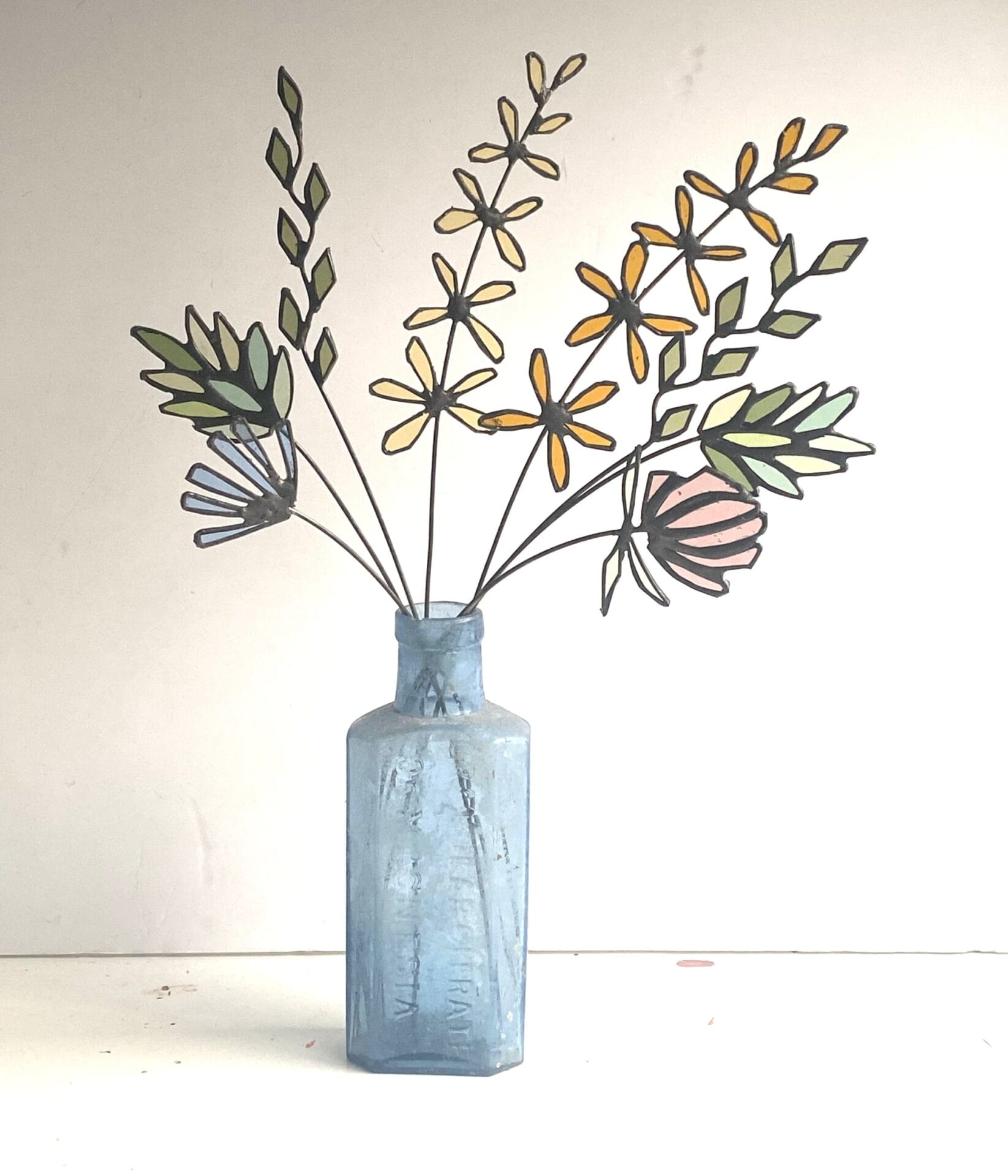 Light Streams through Delicate Floral Bouquets Cast in Colorful Stained