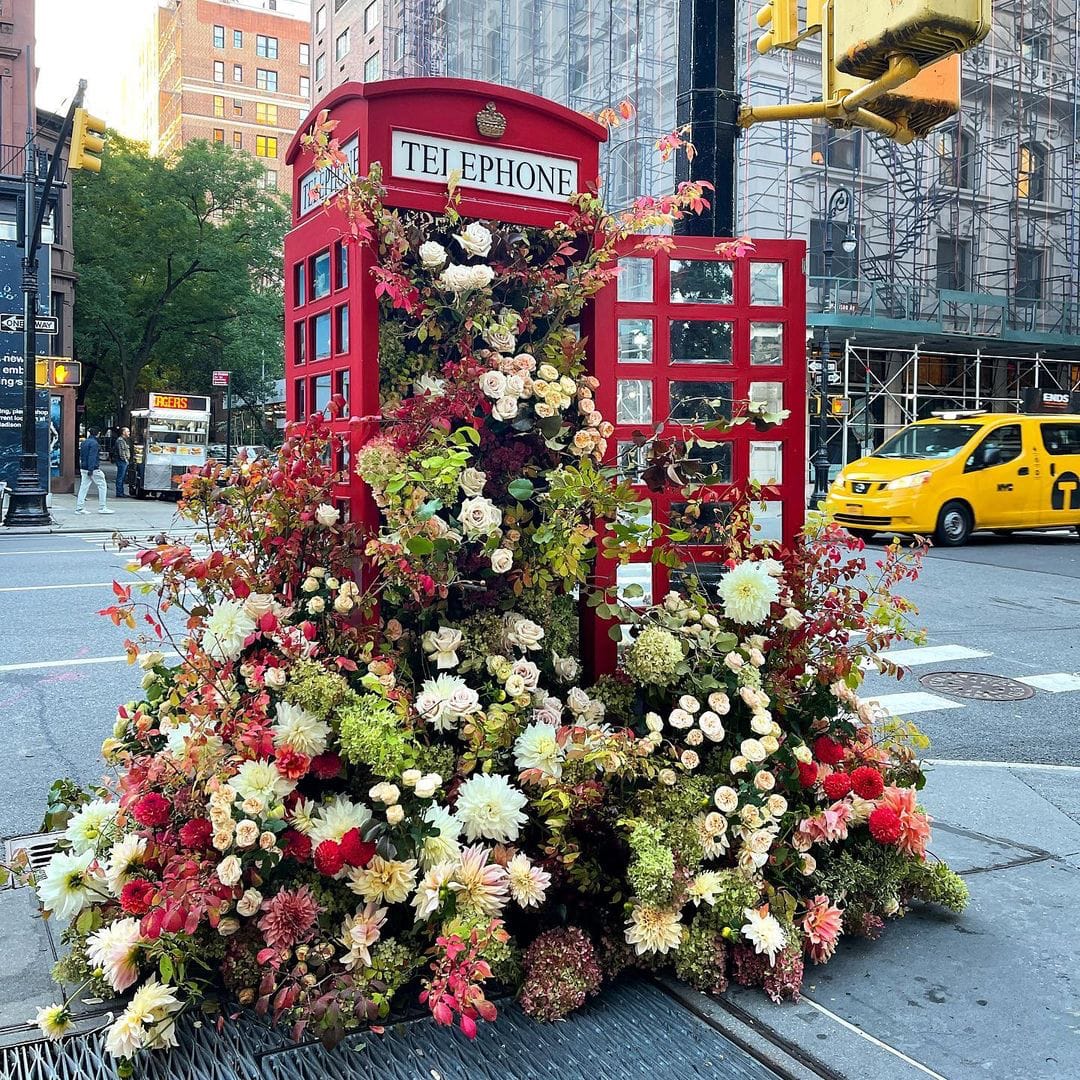 Elaborate Flower Arrangements by Lewis Miller Design Cascade From Fixtures of New York City Streets