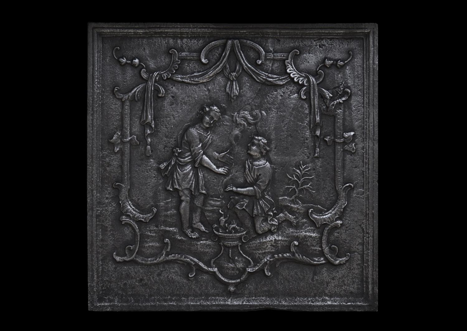 A decorative cast iron fireback Antique Fireplaces and Surrounds