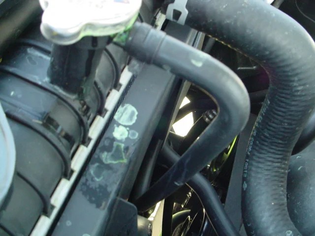 Coolant overflow hose leak at radiator Nissan Titan Forum