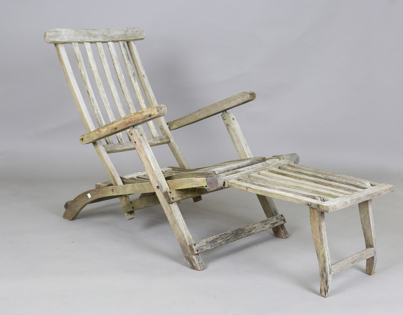 A 20th century teak folding steamer chair, width 60cm, and a teak sun