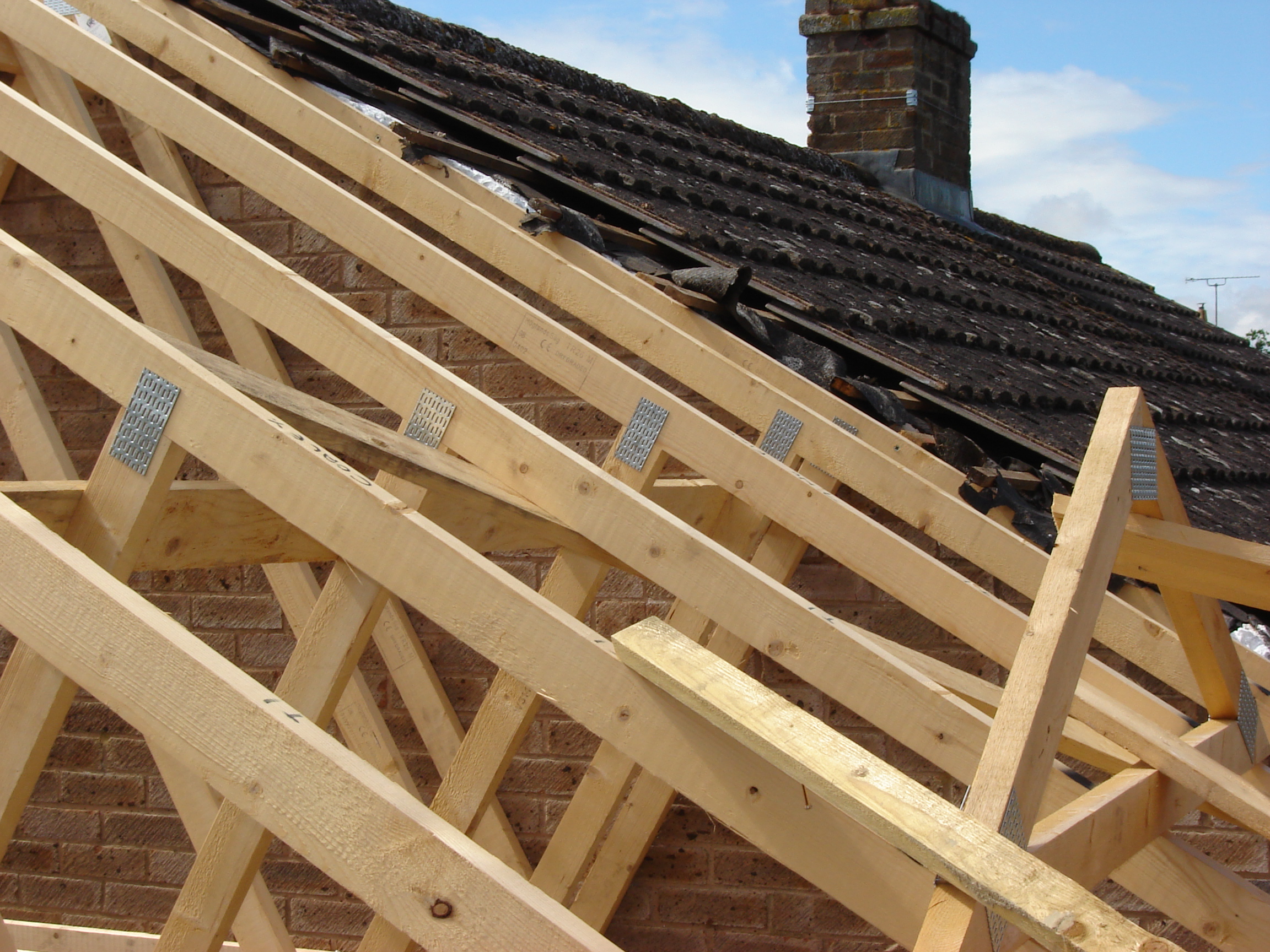 Matching an existing cut roof with roof trusses in Dursley Trussed