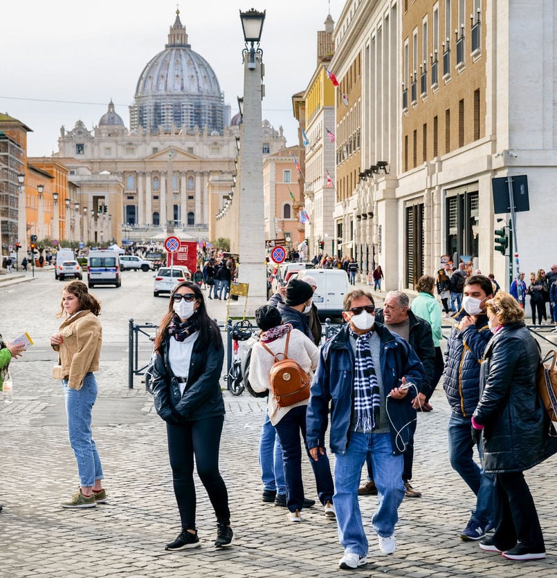 A group of tourists with face masks near the St. Peter's Square, Rome, Italy