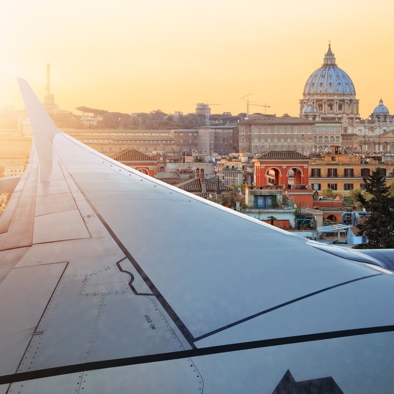 Window View Of Plane Flying Above Rome In Italy, Europe Travel Off Path