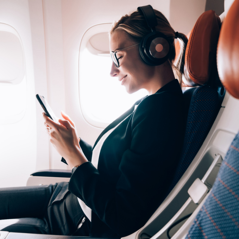 Woman Using Free Inflight Wifi Travel Off Path