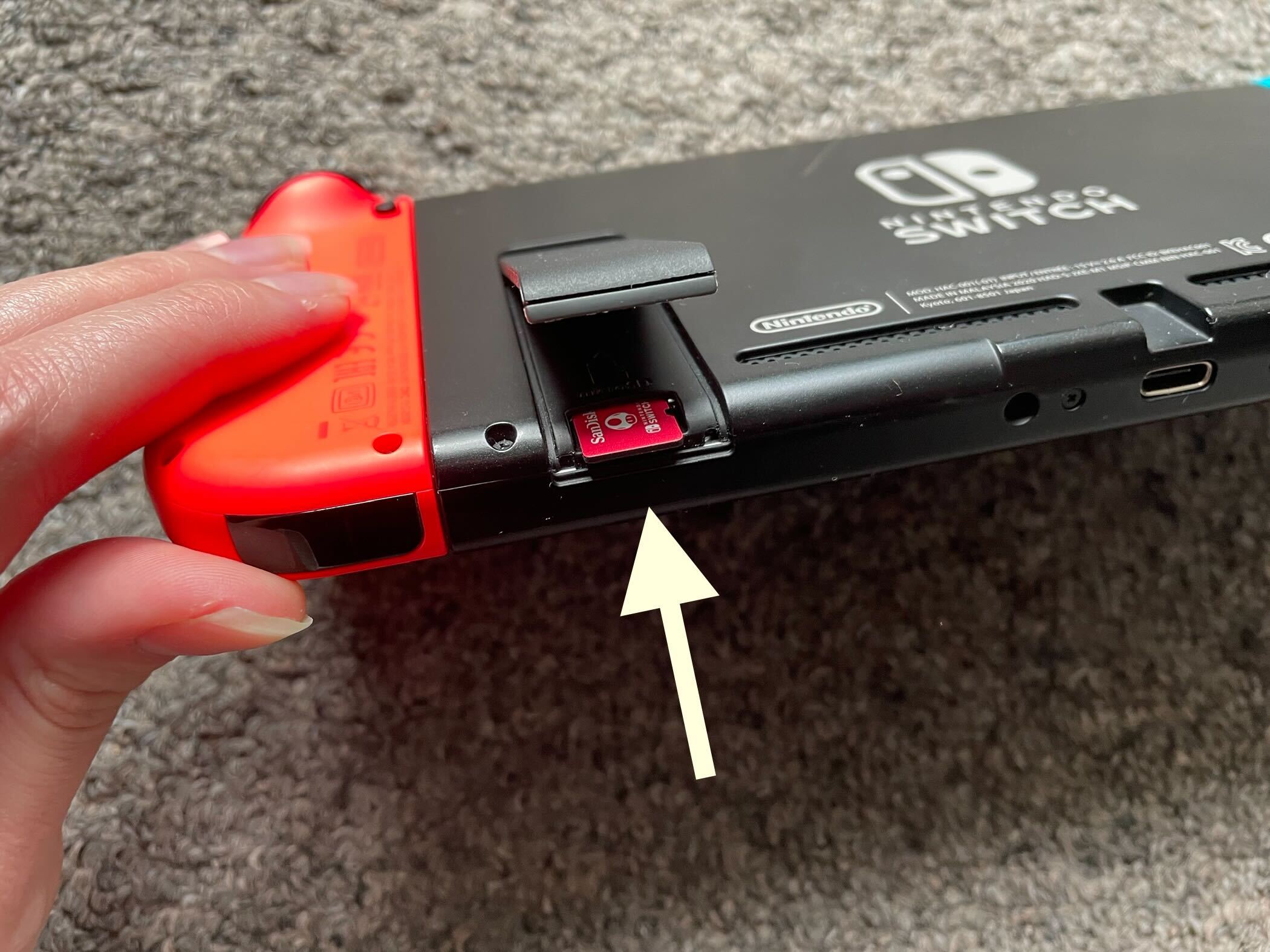 How to insert an SD card into a Nintendo Switch