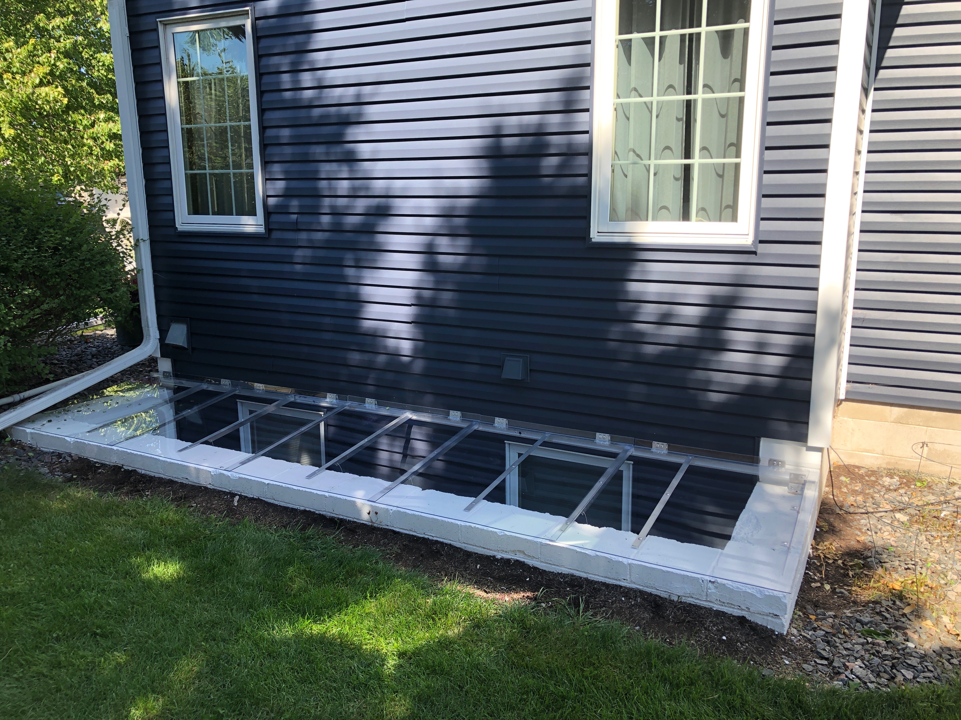 Tundra Custom Window Well Covers Low profile elegent window well covers