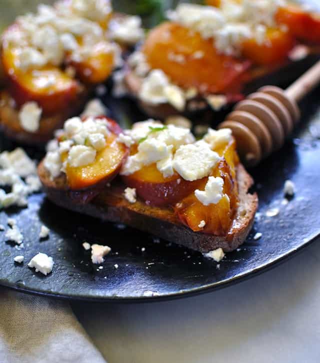 Grilled Peach Crostini with Feta and Fir Honey Turntable Kitchen