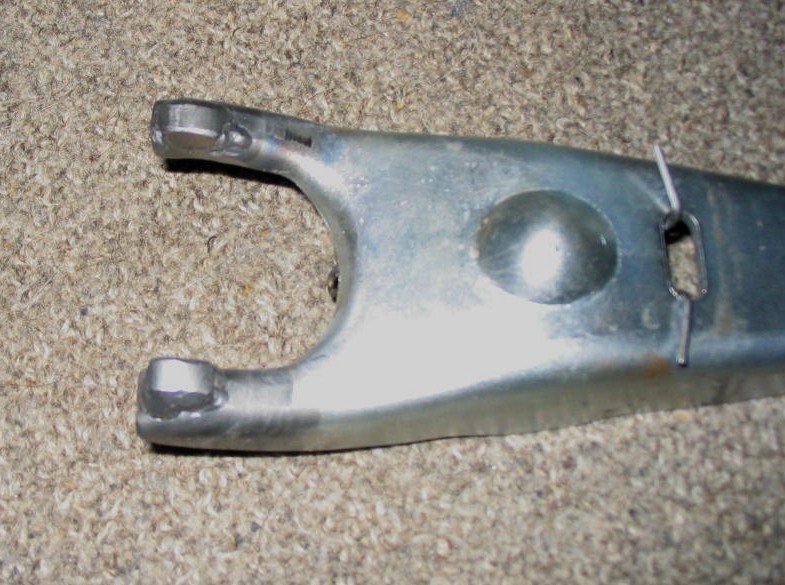 Hydraulic clutch fork with Ford T5 throwout bearing modifications