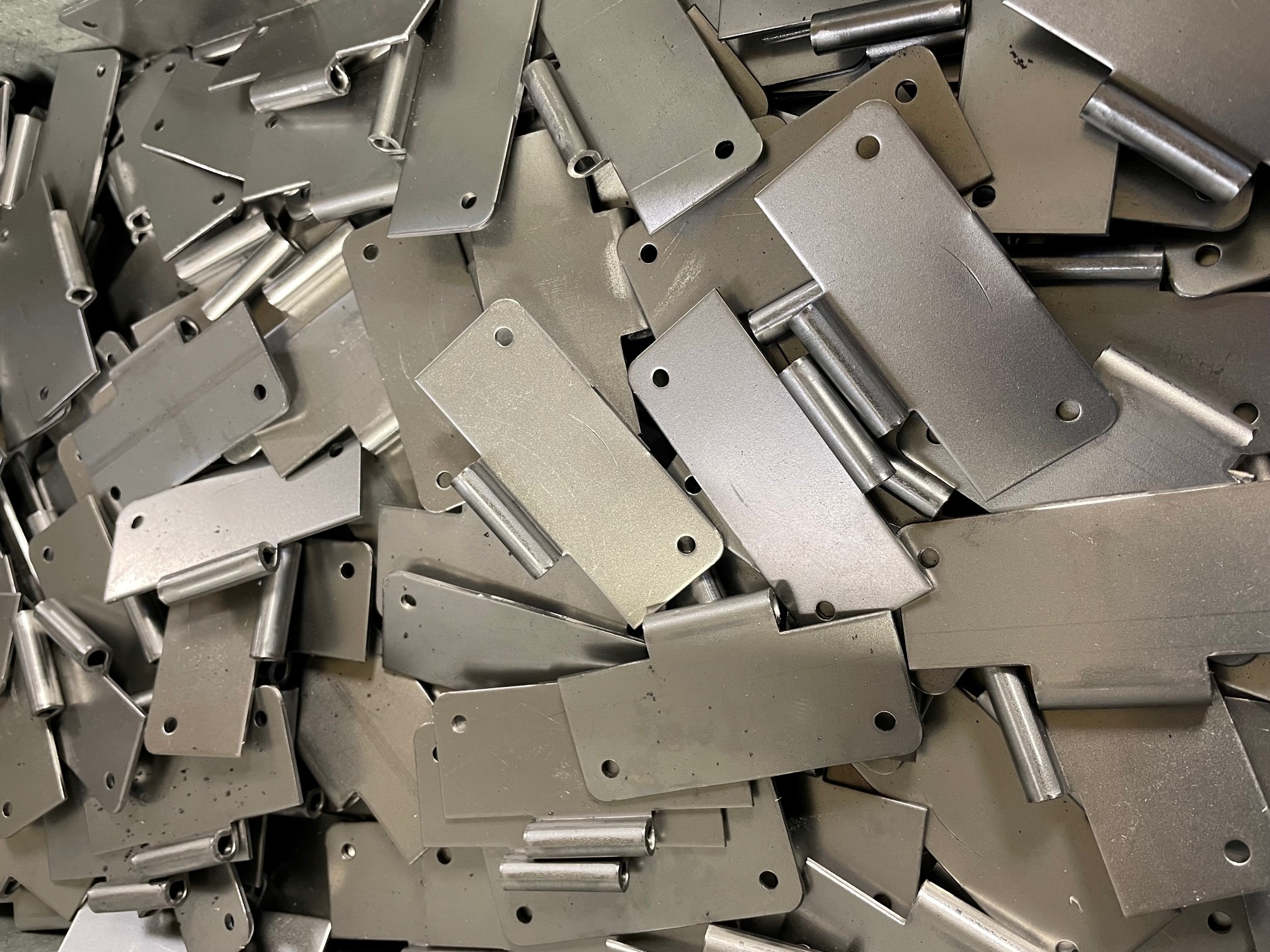 CNC punching sheet metal hinges in mild steel brackets