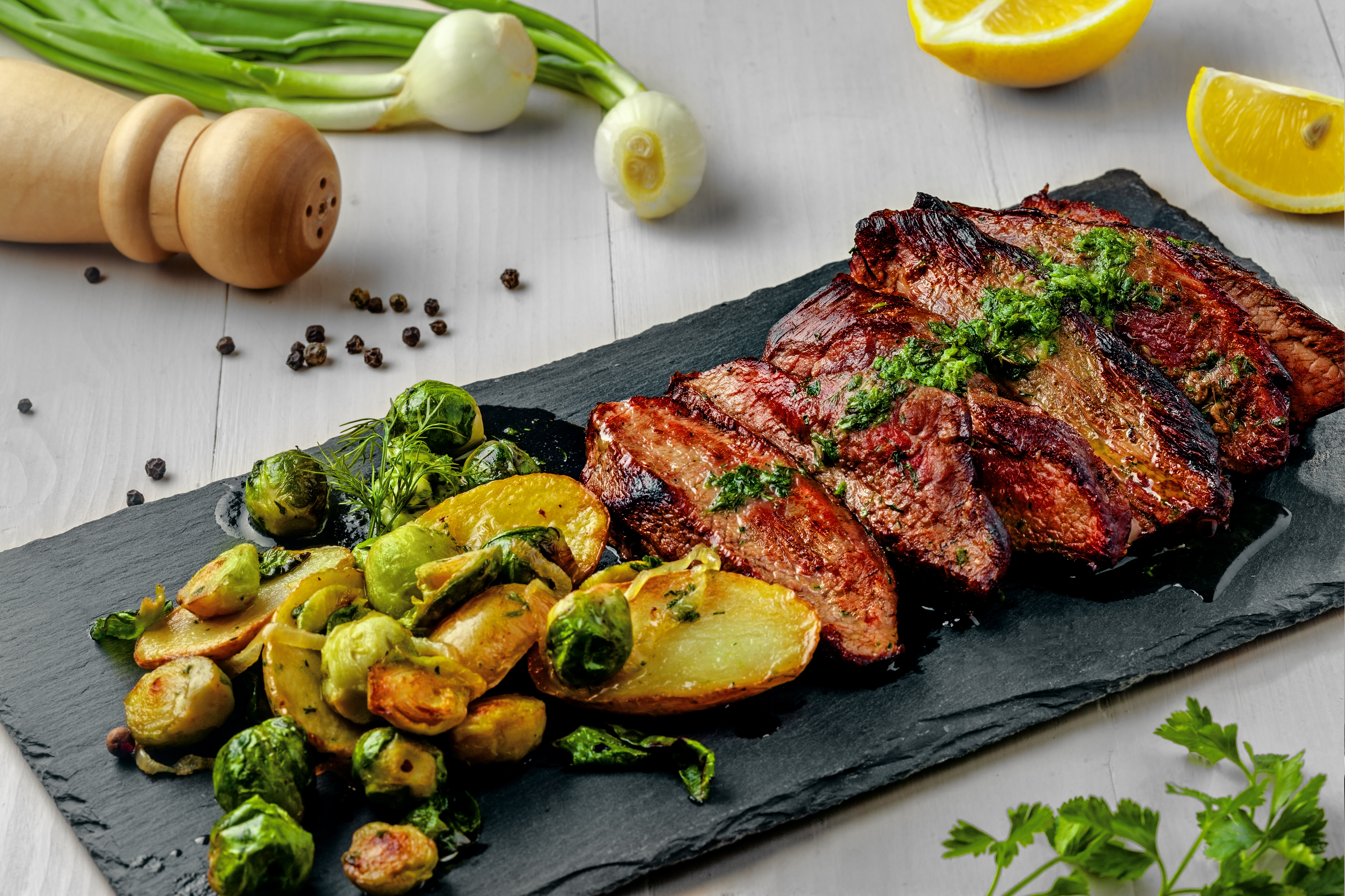 Tasty PanSeared Hanger Steak with brussels sprouts, potatoes and onion
