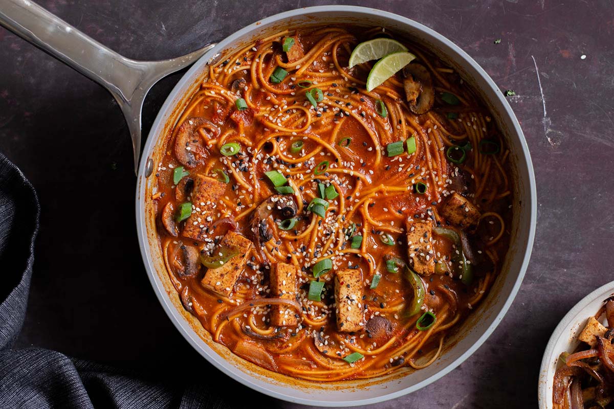birria ramen in the pan after adding garnishes
